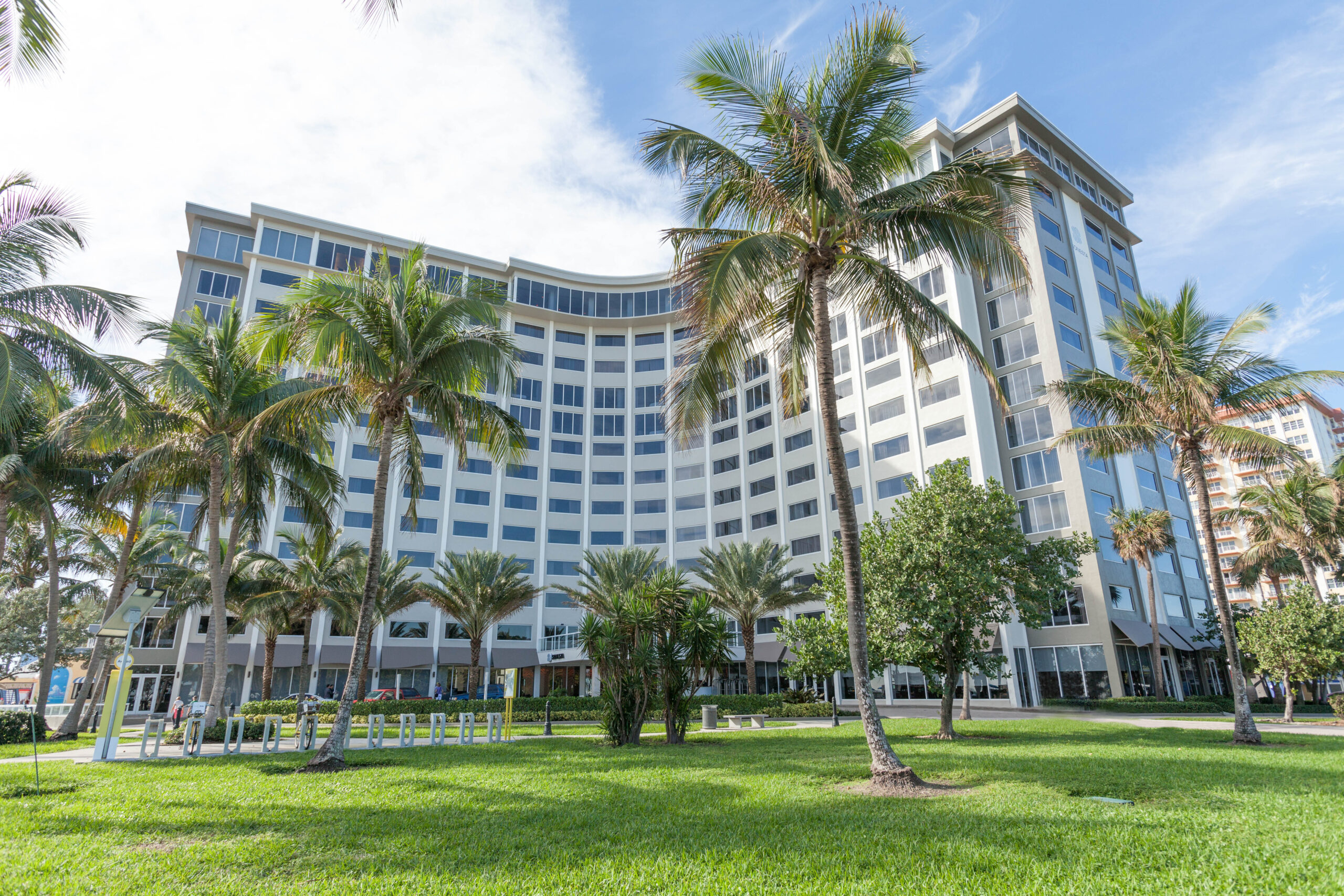 Fort Lauderdale Hotel from exterior view with palm tree.