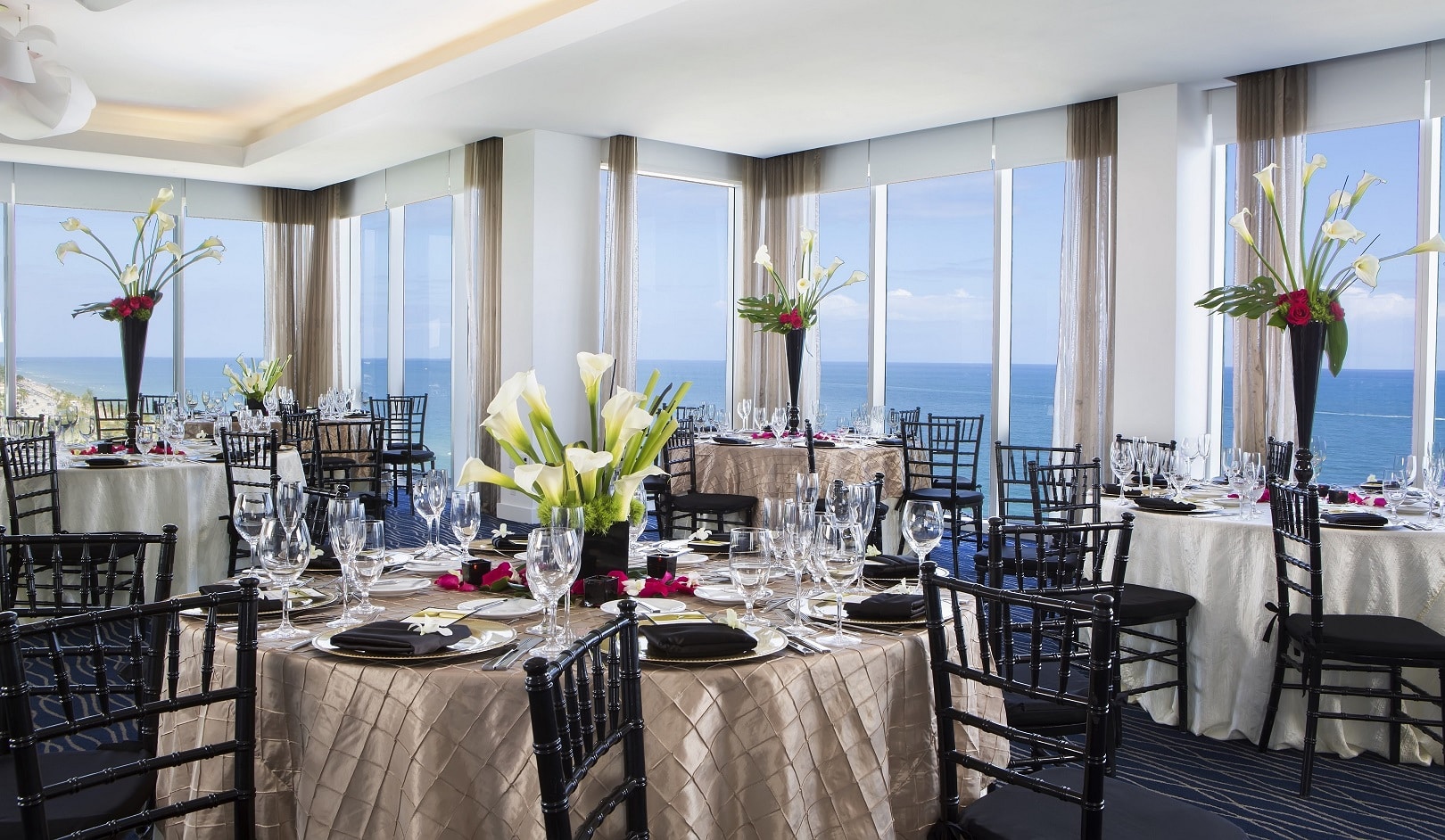 Fort Lauderdale meetings venue Infinity Ballroom with a setting for round wedding.